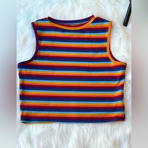 Cool rainbow colored, sleeveless, the fabric is nice really hugs figure